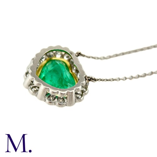 76 - An Emerald And Diamond Heart Shaped Cluster Pendant in 18k yellow gold and platinum, the principal h... 