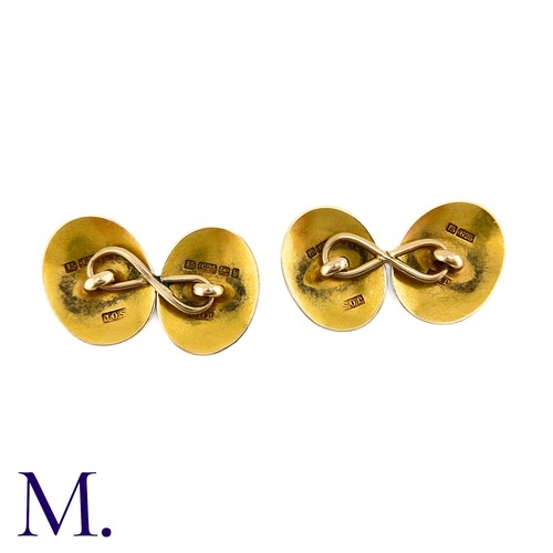 52 - A Pair Of Engraved Oval Cufflinks in 15k yellow gold,  the oval form with engraved celtic pattern de... 