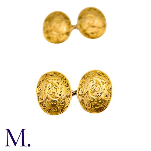 52 - A Pair Of Engraved Oval Cufflinks in 15k yellow gold,  the oval form with engraved celtic pattern de... 