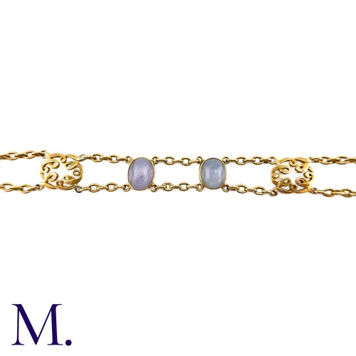 72 - A Star Sapphire Bracelet in 18k yellow gold, comprising two rows of chain set with four cabochon sta... 