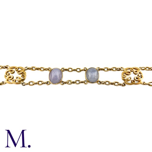 72 - A Star Sapphire Bracelet in 18k yellow gold, comprising two rows of chain set with four cabochon sta... 