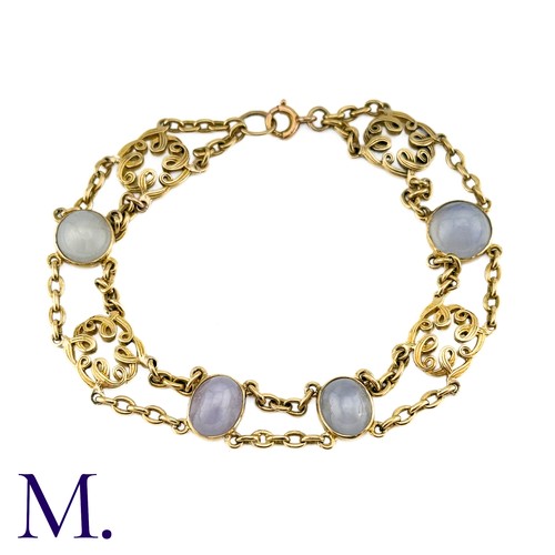 72 - A Star Sapphire Bracelet in 18k yellow gold, comprising two rows of chain set with four cabochon sta... 