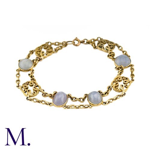 72 - A Star Sapphire Bracelet in 18k yellow gold, comprising two rows of chain set with four cabochon sta... 