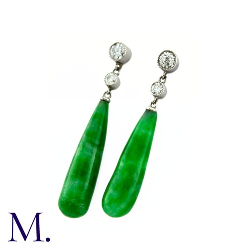 46 - A Pair of Jade Drop Earrings in platinum, two round brilliant cut diamonds suspending the polished j... 