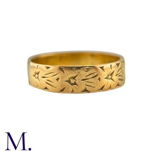 6 - A Gold Band in 22k yellow gold, the 5mm band engraved with foliate decoration. Hallmarks for 22ct go... 