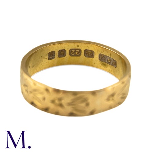 6 - A Gold Band in 22k yellow gold, the 5mm band engraved with foliate decoration. Hallmarks for 22ct go... 