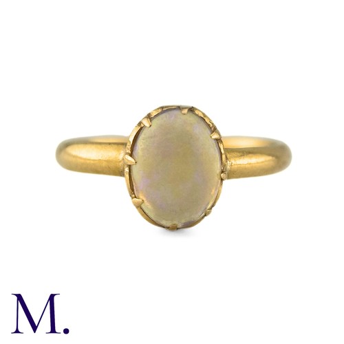 4 - An Antique Opal Ring the central cabochon opal claw set to a gold band. (Unmarked but tests indicate... 