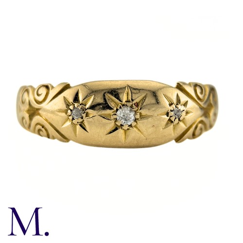 64 - A Diamond Three Stone Gypsy Ring in 18k yellow gold, set with three old cut diamonds. Partially Hall... 