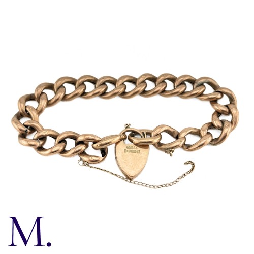 1 - An Antique Curb Bracelet in 9k rose gold, comprising a series of polished curb links, suspending a h... 