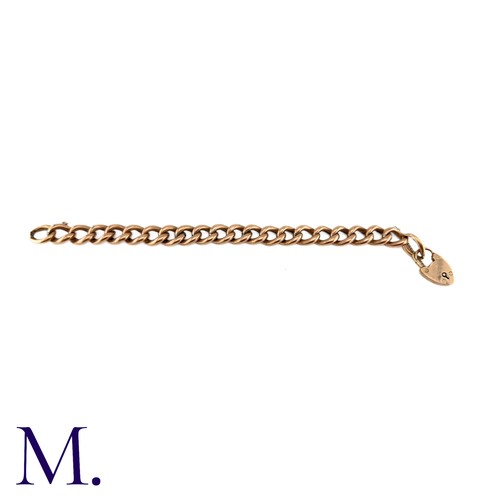 1 - An Antique Curb Bracelet in 9k rose gold, comprising a series of polished curb links, suspending a h... 