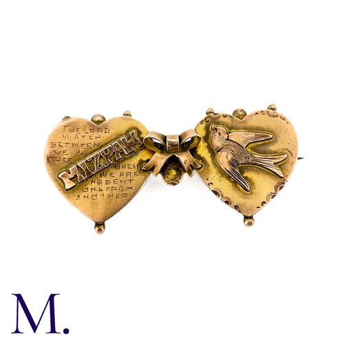 19 - An Antique Mizpah Brooch in 9k gold, designed as two hearts embossed with the word 'mizpah' and engr... 