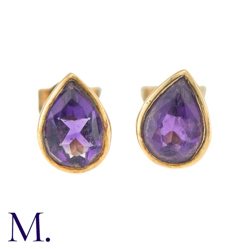 20 - A Pair Of Amethyst Stud Earrings in 9k yellow gold, comprising two collet set pear shaped amethysts.... 