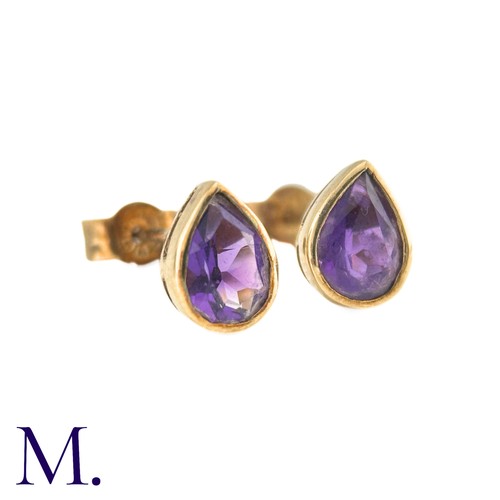 20 - A Pair Of Amethyst Stud Earrings in 9k yellow gold, comprising two collet set pear shaped amethysts.... 