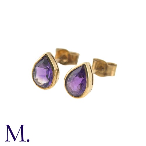 20 - A Pair Of Amethyst Stud Earrings in 9k yellow gold, comprising two collet set pear shaped amethysts.... 