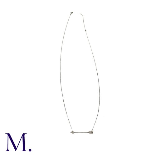 54 - A Diamond Arrow Pendant Necklace in 9k white gold, designed as an arrow set to the head with a round... 