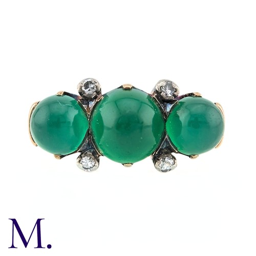 23 - An Antique Chrysoprase and Diamond Ring in 18K yellow gold.  Set with three cabochon chrysoprase sto... 