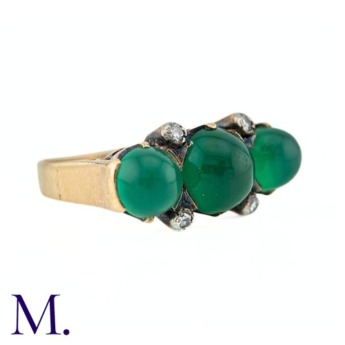 23 - An Antique Chrysoprase and Diamond Ring in 18K yellow gold.  Set with three cabochon chrysoprase sto... 