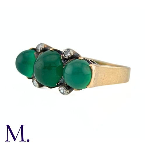 23 - An Antique Chrysoprase and Diamond Ring in 18K yellow gold.  Set with three cabochon chrysoprase sto... 