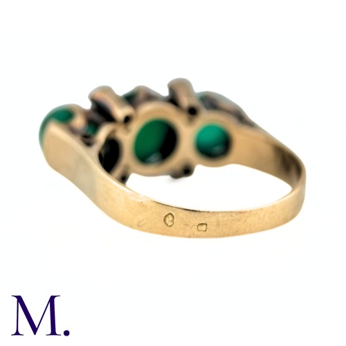 23 - An Antique Chrysoprase and Diamond Ring in 18K yellow gold.  Set with three cabochon chrysoprase sto... 