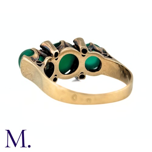 23 - An Antique Chrysoprase and Diamond Ring in 18K yellow gold.  Set with three cabochon chrysoprase sto... 