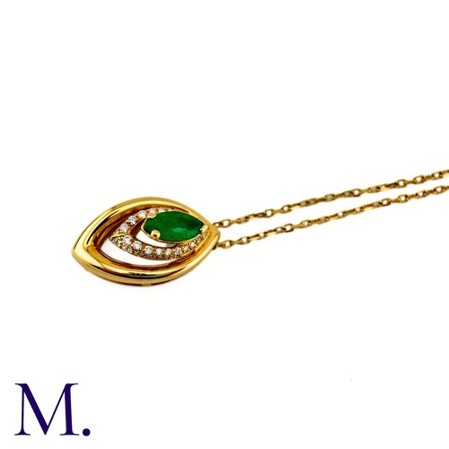 80 - An Emerald And Diamond Pendant in 18k yellow gold, set with a marquise cut emerald and accented by r... 