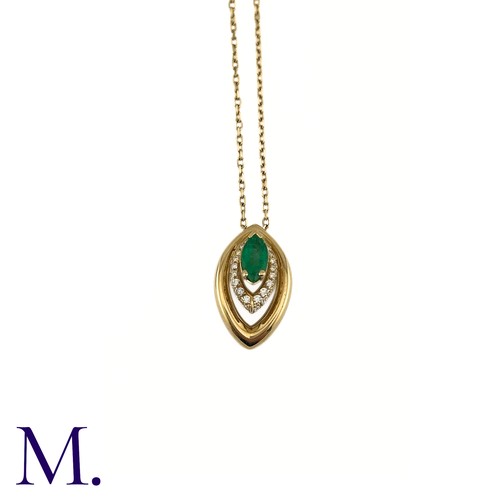 80 - An Emerald And Diamond Pendant in 18k yellow gold, set with a marquise cut emerald and accented by r... 