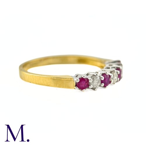 25 - A Ruby And Diamond Seven Stone Ring in 18k yellow gold, set with a row of alternating rubies and dia... 