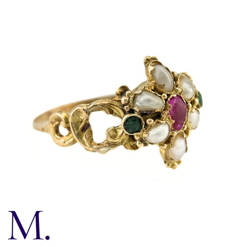 27 - An Antique Ruby, Pearl And Emerald Ring in yellow gold, set with a central pear shape ruby, surround... 