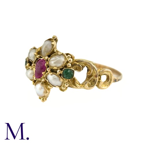 27 - An Antique Ruby, Pearl And Emerald Ring in yellow gold, set with a central pear shape ruby, surround... 