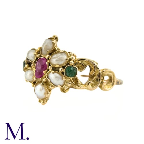 27 - An Antique Ruby, Pearl And Emerald Ring in yellow gold, set with a central pear shape ruby, surround... 