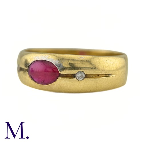 28 - A Ruby And Diamond Gypsy Ring in 18k yellow gold, set to the centre with a cabochon ruby, flanked ea... 