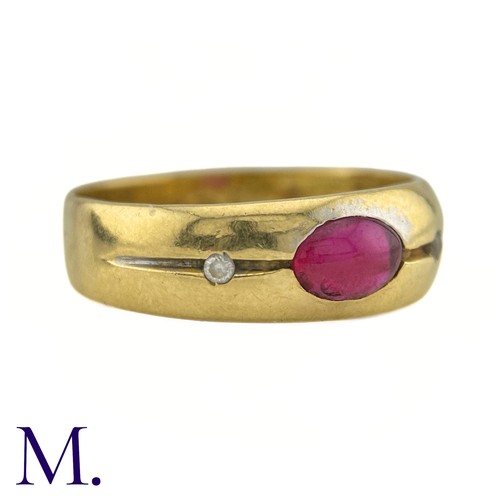 28 - A Ruby And Diamond Gypsy Ring in 18k yellow gold, set to the centre with a cabochon ruby, flanked ea... 