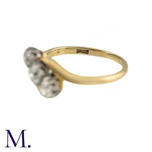 63 - A Diamond Three Stone Twist Ring in 18k gold, Set with three round cut diamonds totalling approximat... 