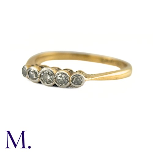 62 - A Diamond Five Stone Ring in 18k gold and platinum, designed as a row of five round cut diamonds col... 