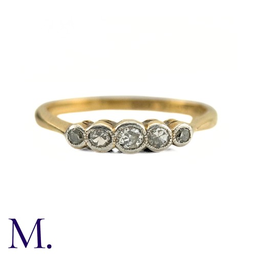 62 - A Diamond Five Stone Ring in 18k gold and platinum, designed as a row of five round cut diamonds col... 