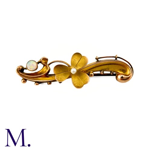 30 - An Opal And Pearl Brooch in 9k yellow gold, centrally set with a pearl set clover, with a scrolling ... 