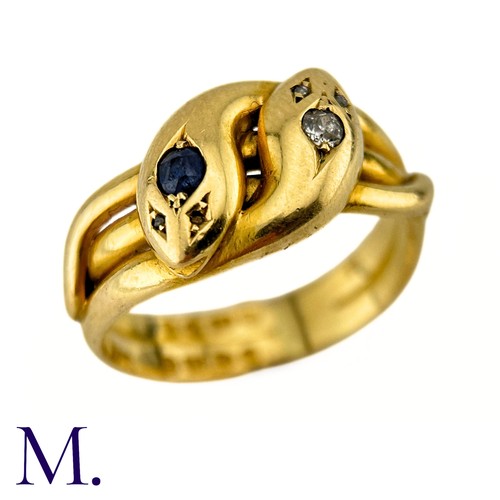 42 - An Antique Sapphire And Diamond Snake Ring in 18k yellow gold, designed and two intertwined snakes o... 