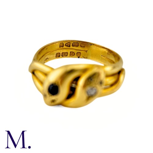 42 - An Antique Sapphire And Diamond Snake Ring in 18k yellow gold, designed and two intertwined snakes o... 