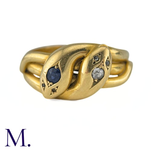 42 - An Antique Sapphire And Diamond Snake Ring in 18k yellow gold, designed and two intertwined snakes o... 