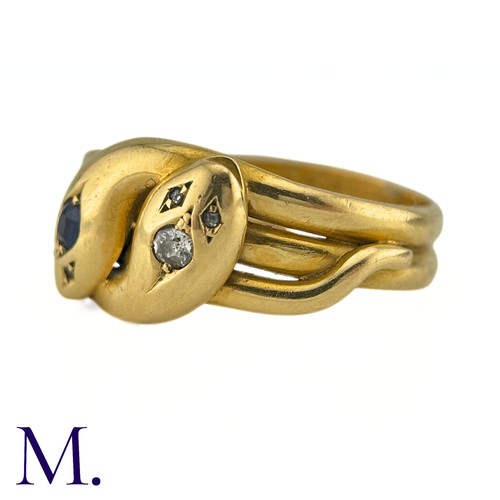 42 - An Antique Sapphire And Diamond Snake Ring in 18k yellow gold, designed and two intertwined snakes o... 