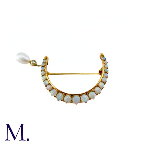 82 - An Opal, Diamond And Pearl Crescent Brooch in yellow gold, designed as a crescent moon set with cabo... 