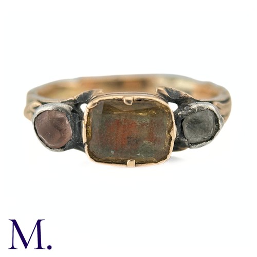 61 - An Antique Chrysoberyl And Goshenite Three Stone Ring in yellow gold, the central chrysoberyl flanke... 