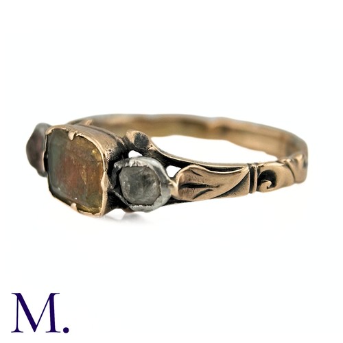 61 - An Antique Chrysoberyl And Goshenite Three Stone Ring in yellow gold, the central chrysoberyl flanke... 