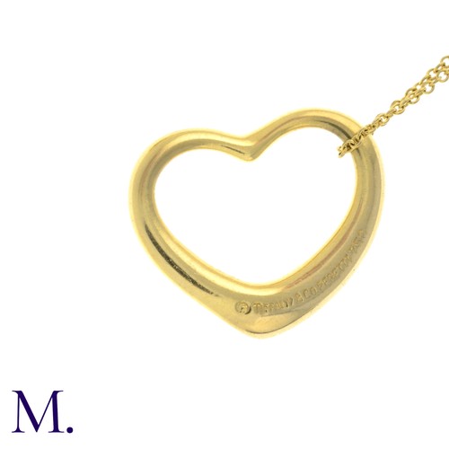 55 - An Open Heart Pendant with Chain by Tiffany & Co. 

The 18ct yellow gold pendant (22mm version) is m... 