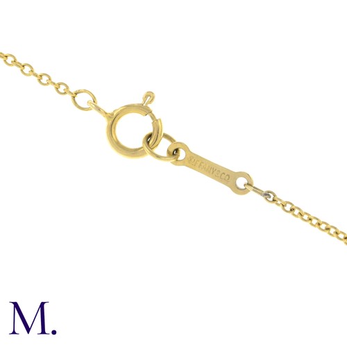 55 - An Open Heart Pendant with Chain by Tiffany & Co. 

The 18ct yellow gold pendant (22mm version) is m... 