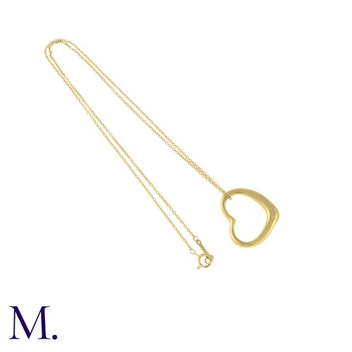 55 - An Open Heart Pendant with Chain by Tiffany & Co. 

The 18ct yellow gold pendant (22mm version) is m... 