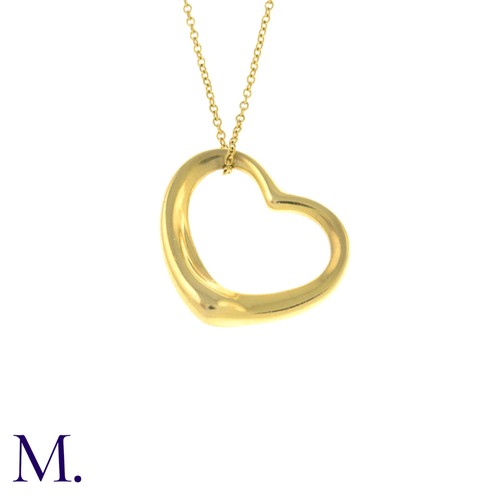 55 - An Open Heart Pendant with Chain by Tiffany & Co. 

The 18ct yellow gold pendant (22mm version) is m... 