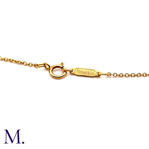 55 - An Open Heart Pendant with Chain by Tiffany & Co. 

The 18ct yellow gold pendant (22mm version) is m... 