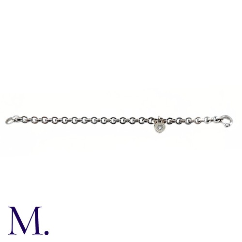 37 - Chopard Diamond Heart Charm Bracelet in 18K white gold.  Marked for Chopard, 18ct white gold with gl... 