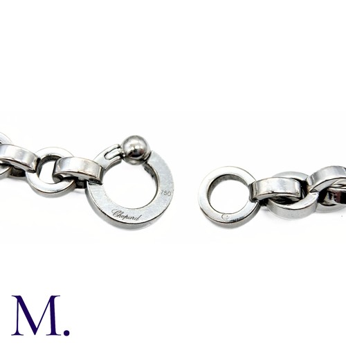 37 - Chopard Diamond Heart Charm Bracelet in 18K white gold.  Marked for Chopard, 18ct white gold with gl... 